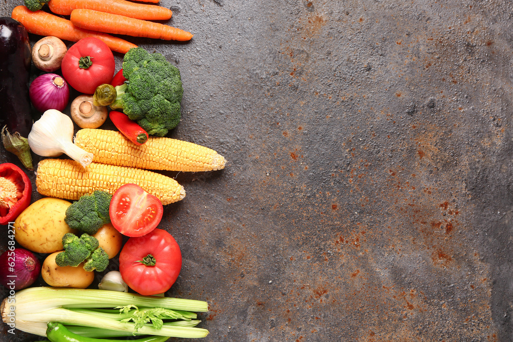 Different fresh vegetables on dark background