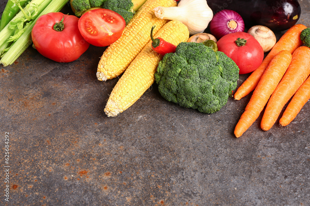 Different fresh vegetables on dark background