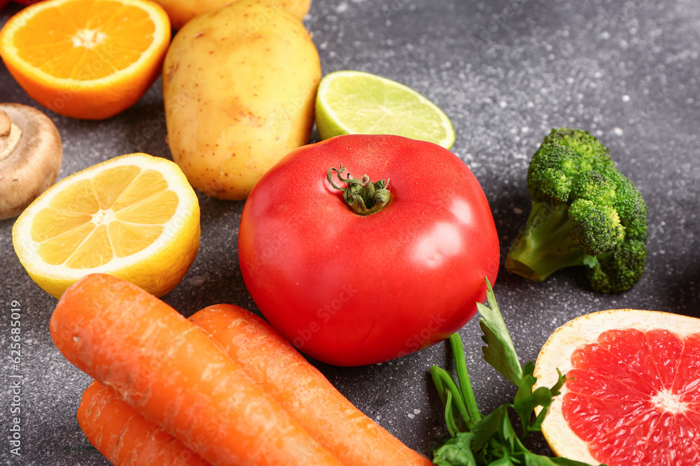 Different fresh vegetables on grey background