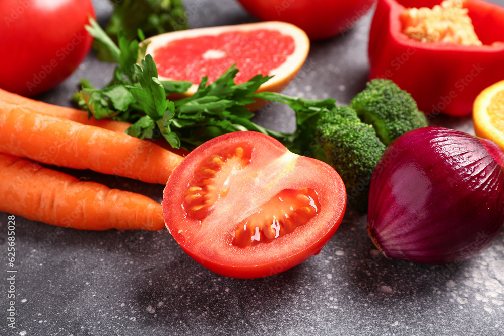 Different fresh vegetables on grey background