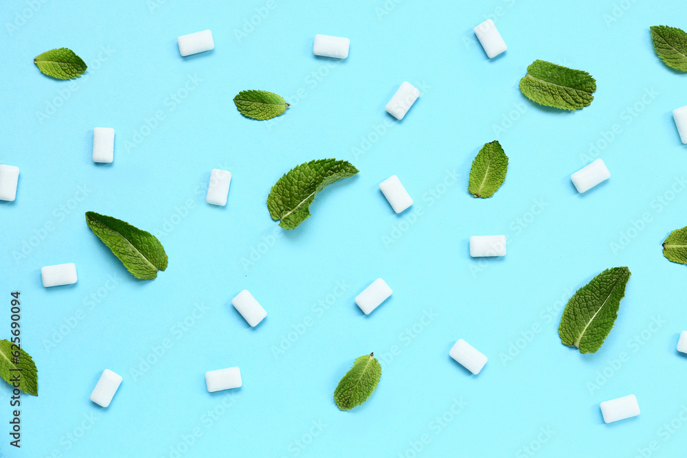 Fresh chewing gums with mint on blue background