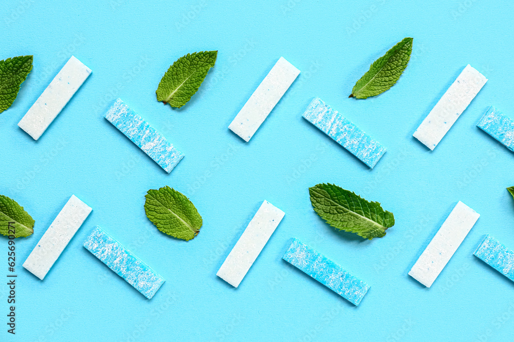 Fresh chewing gums with mint on blue background