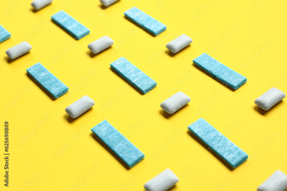 Fresh chewing gums on yellow background