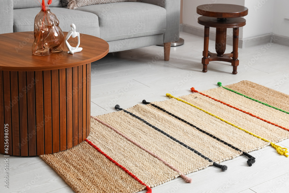 Stylish rug in interior of living room