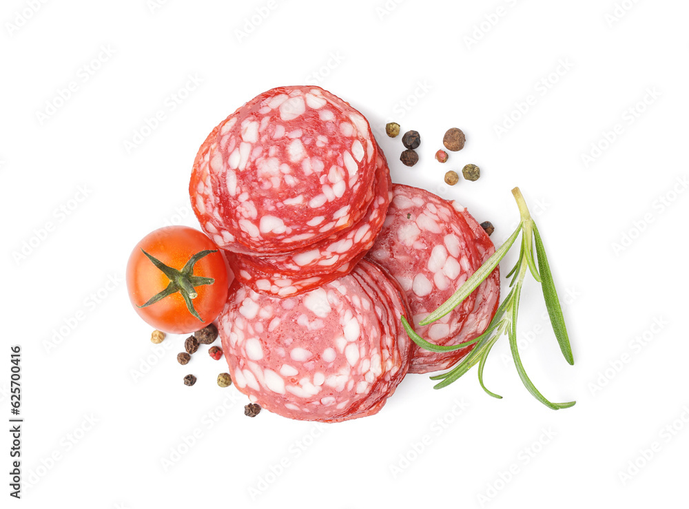 Slices of tasty salami with spices on white background