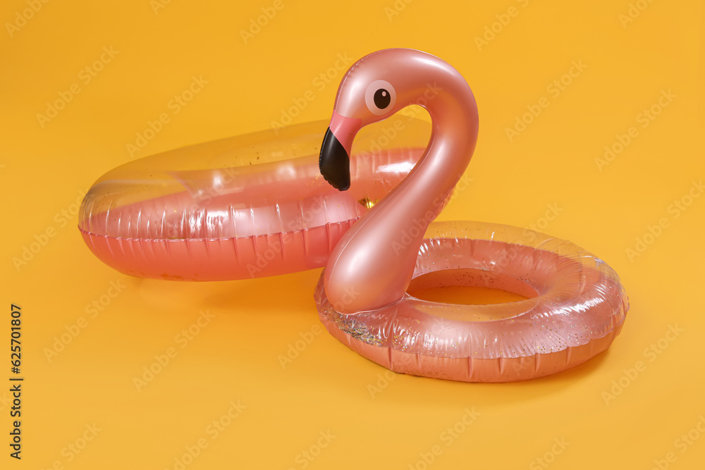 Inflatable rings on yellow background