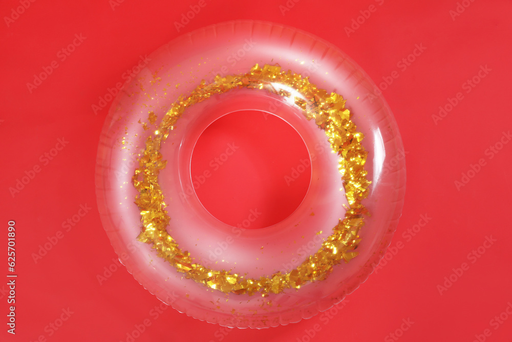 Inflatable ring on red background