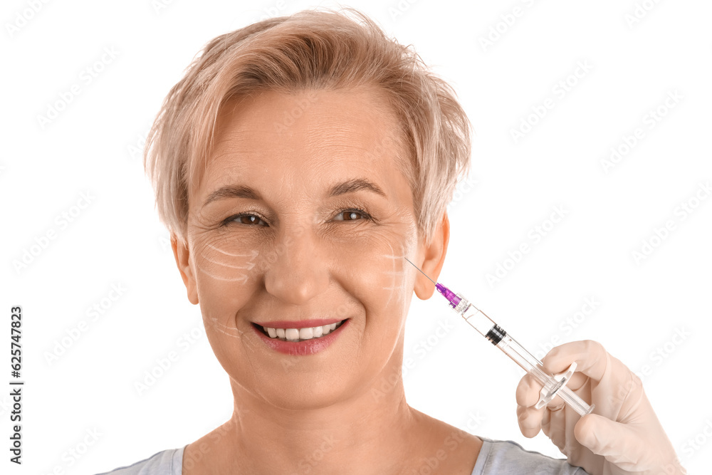 Mature woman receiving filler injection on white background, closeup