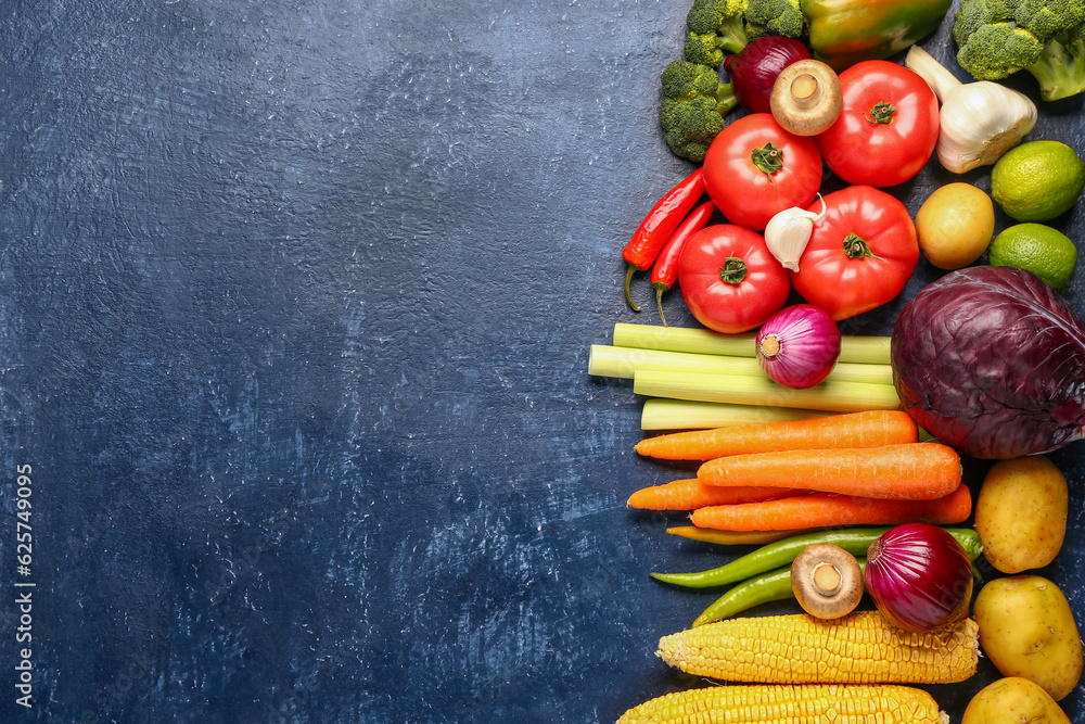 Different fresh vegetables on blue background