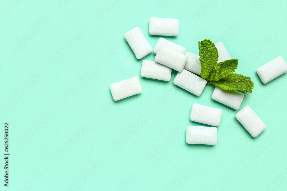 Fresh chewing gums with mint on turquoise background