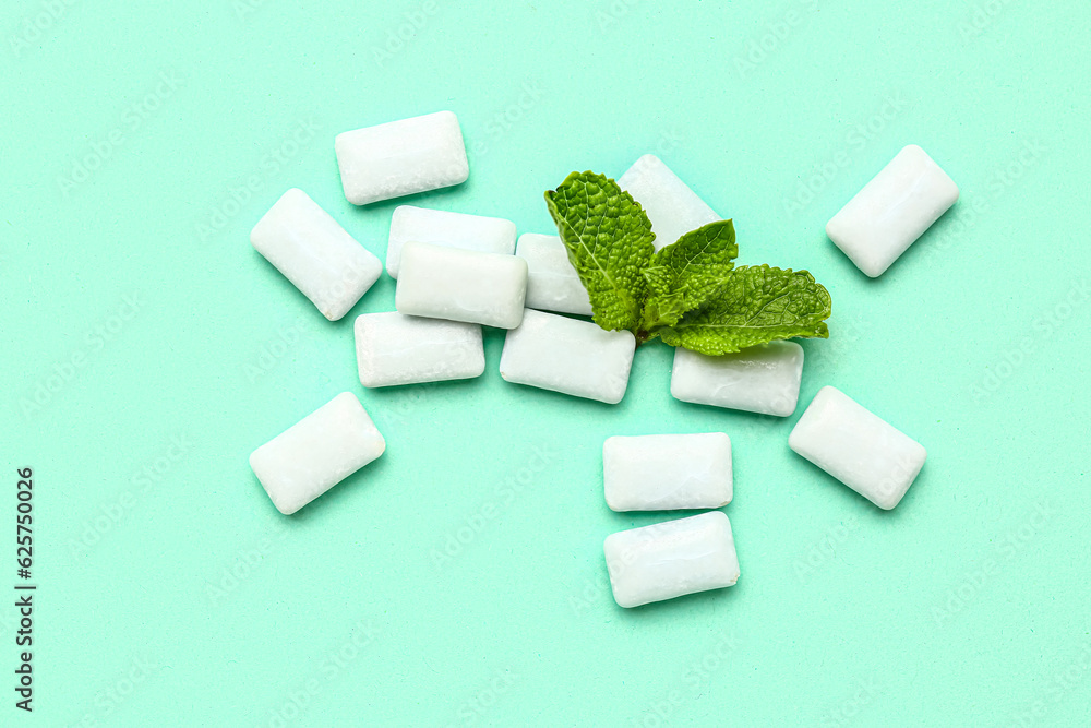 Fresh chewing gums with mint on turquoise background