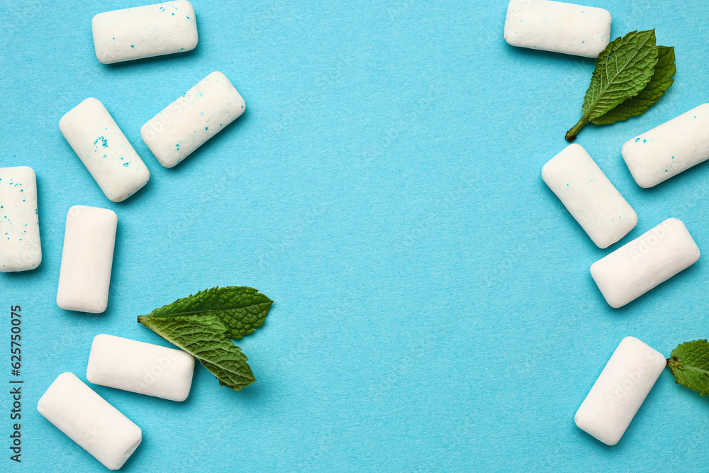 Fresh chewing gums with mint on blue background