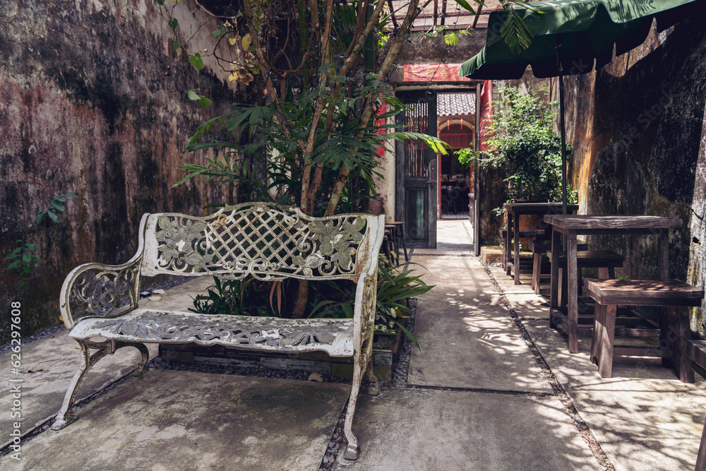 The streets of the old town of Takua pa, Phang Nga province, a cozy place in the shade, a shop in sh