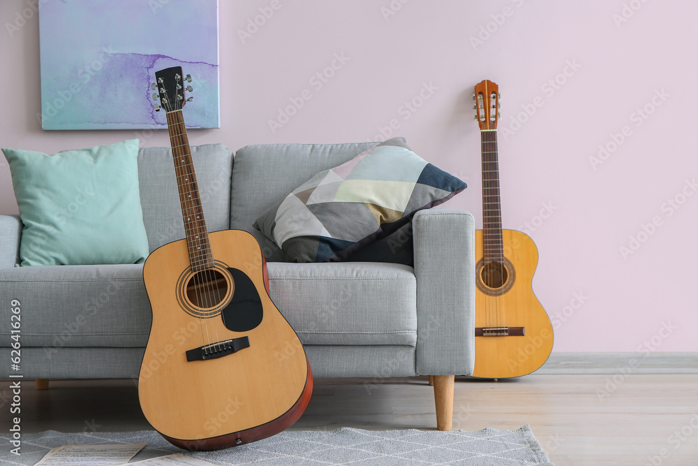 Interior of room with sofa and guitars