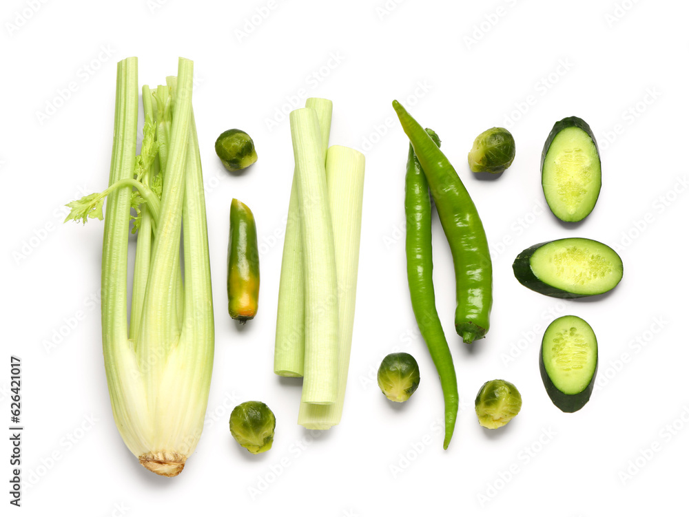 Cucumber with celery, brussels sprouts and green pepper on white background