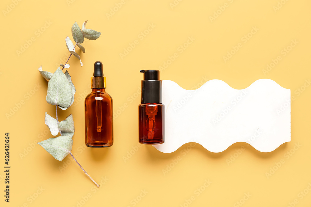 Composition with bottles of cosmetic products, plaster podium and eucalyptus branch on color backgro