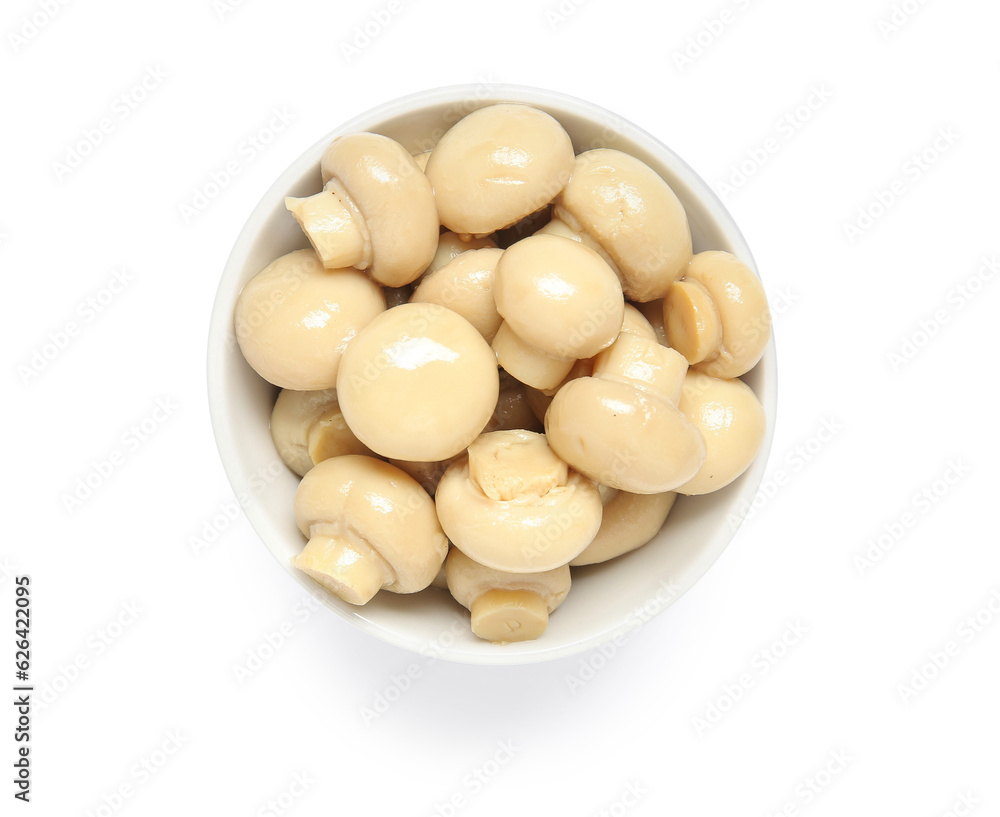 Bowl of canned mushrooms isolated on white background