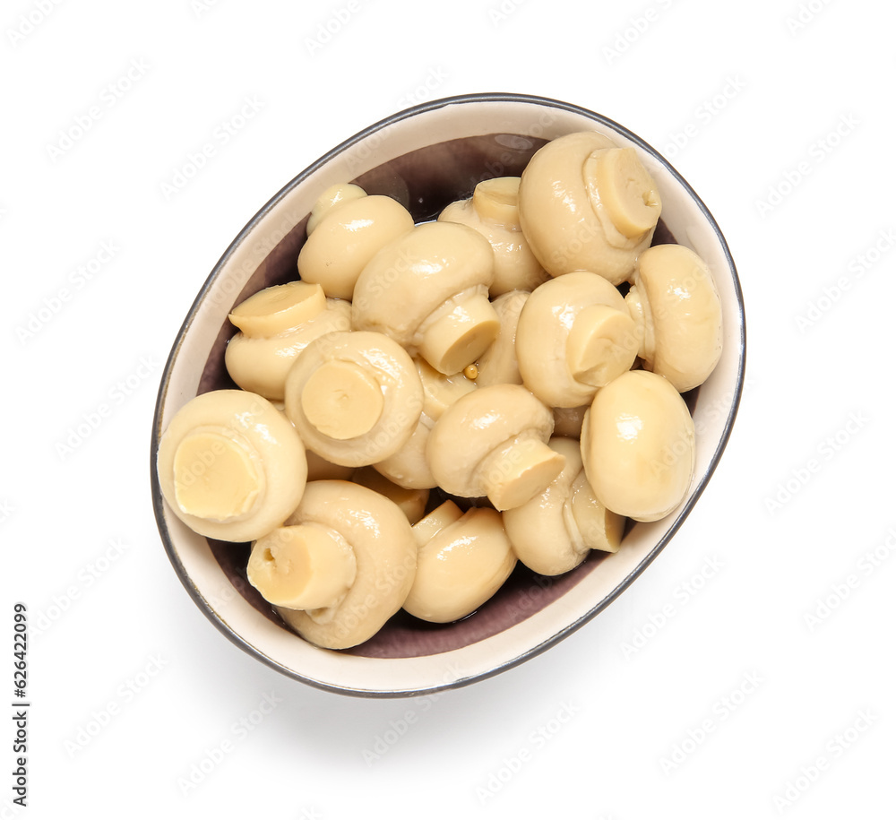 Bowl of canned mushrooms isolated on white background