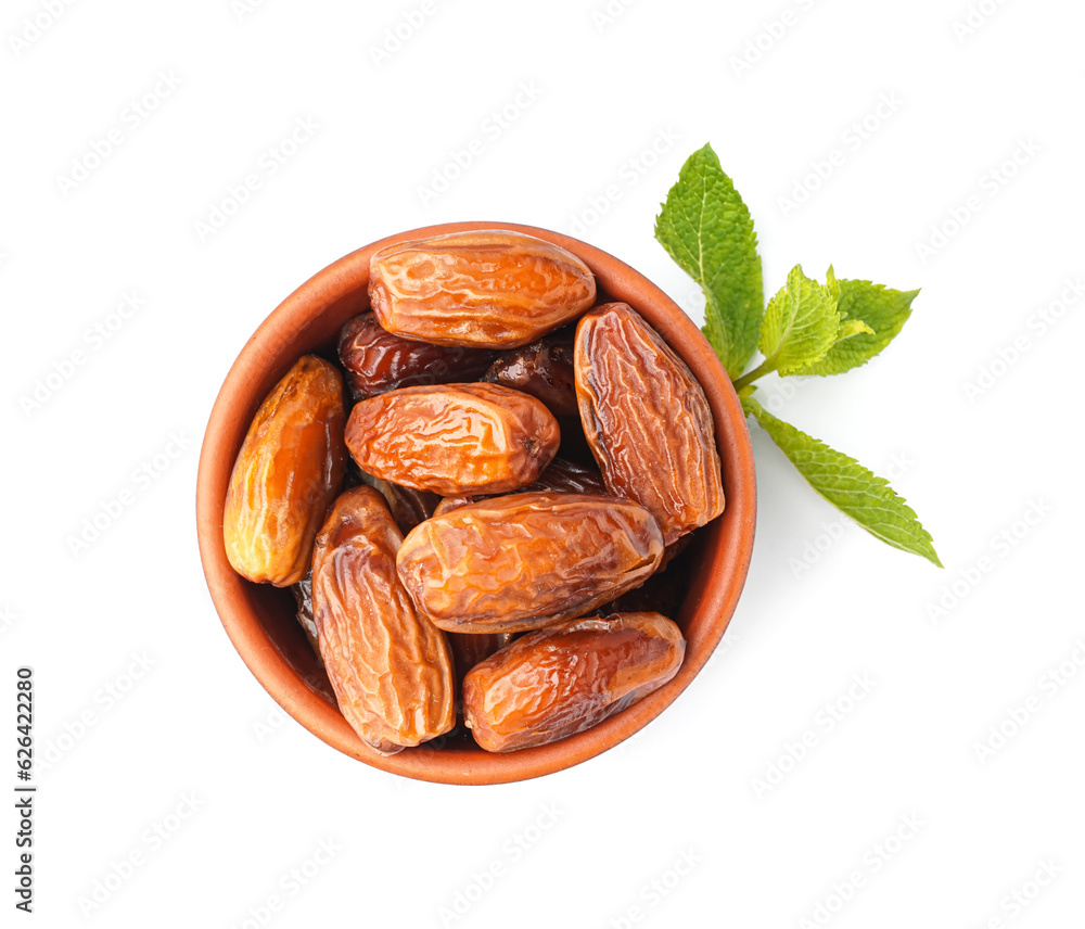 Bowl with dried dates on white background