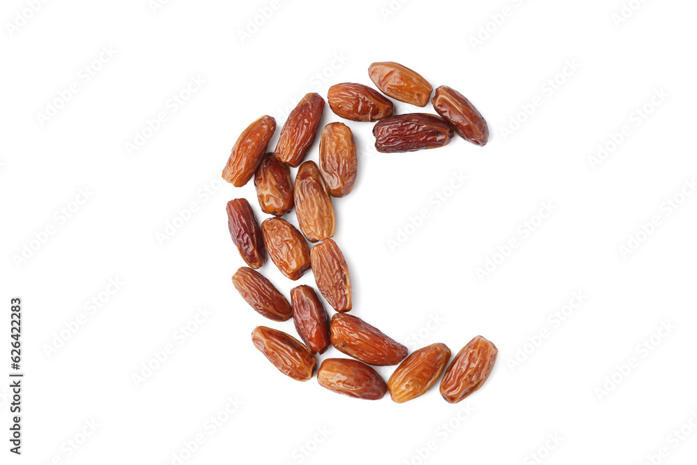 Crescent made of dried dates on white background