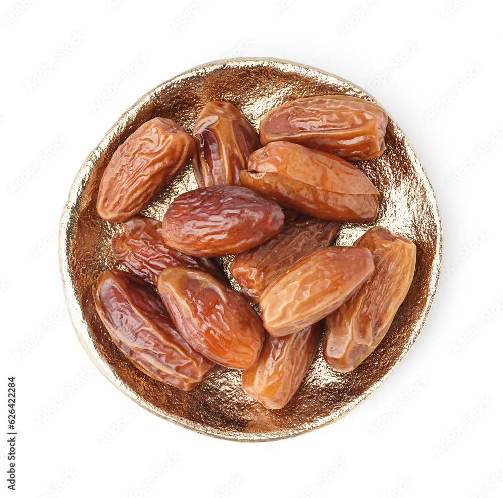 Plate with dried dates on white background