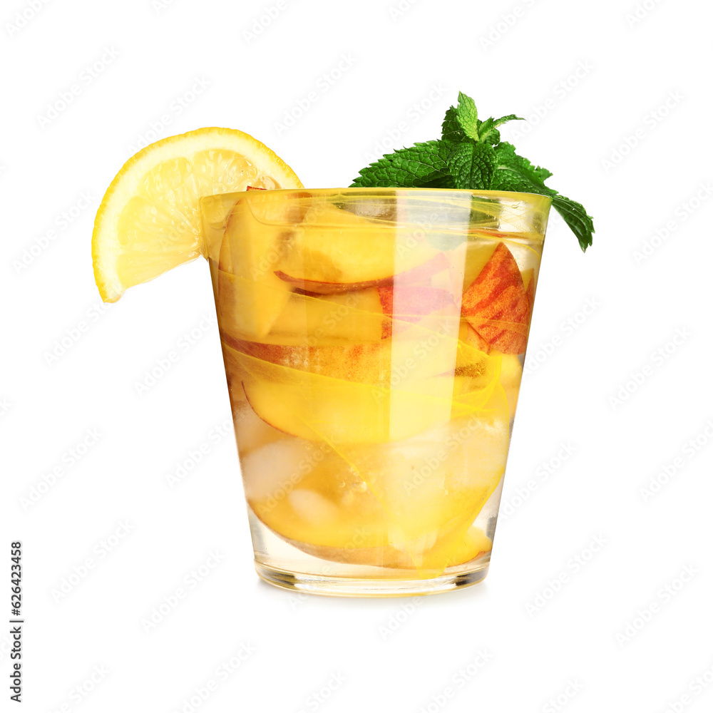 Glass of fresh peach lemonade with mint on white background