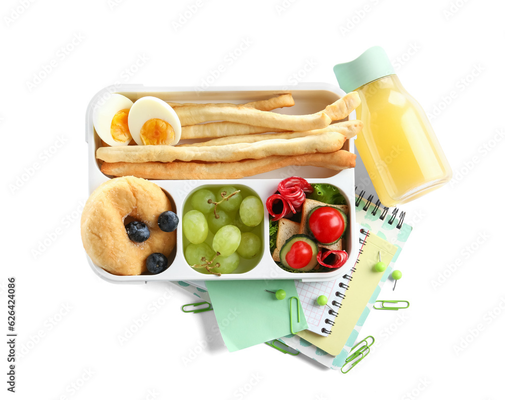 Lunchbox with delicious food, bottle of juice and stationery isolated on white background