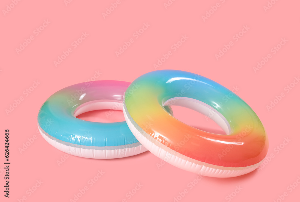 Inflatable rings on pink background