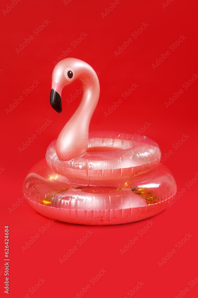 Inflatable rings on red background