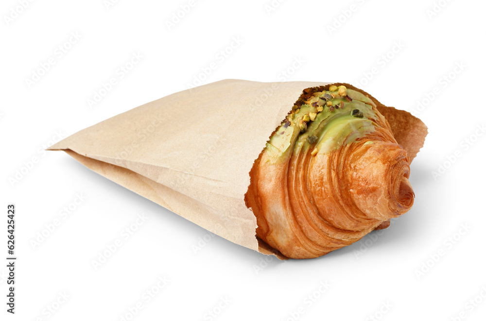 Paper bag with tasty sweet croissant isolated on white background