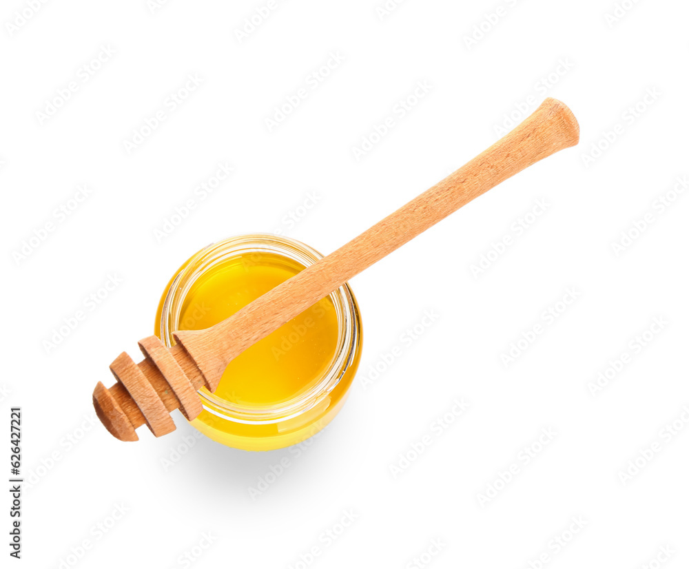 Jar of sweet honey and dipper on white background