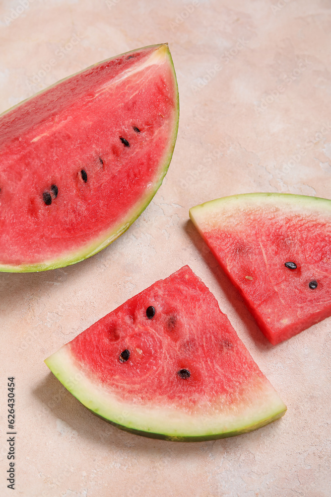 Composition with pieces of ripe watermelon on beige background