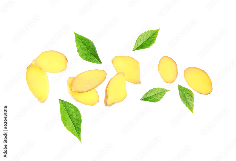 Flying slices of fresh ginger root and leaves on white background