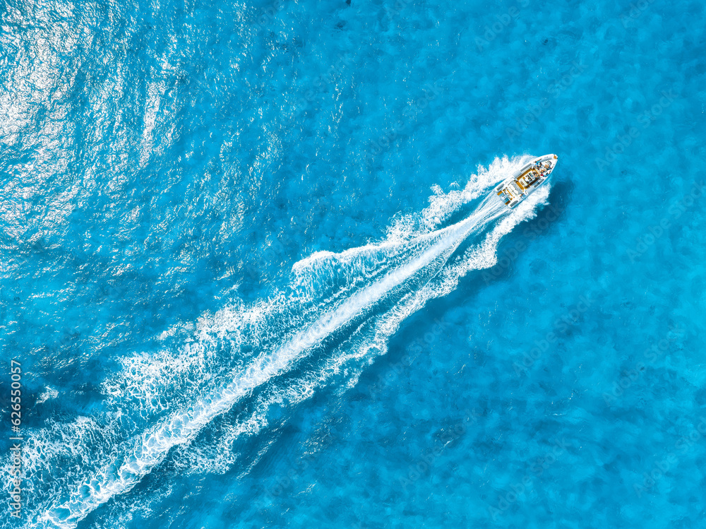 Vacation and leisure. Aerial view on fast boat on blue Mediterranean sea at sunny day. Fast ship on 