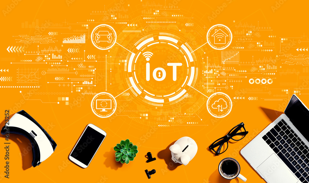 IoT theme with electronic gadgets and office supplies - flat lay