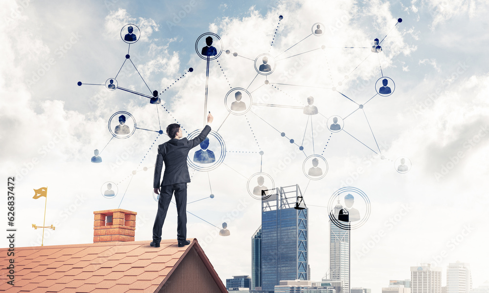 Businessman on house roof presenting networking and connection c