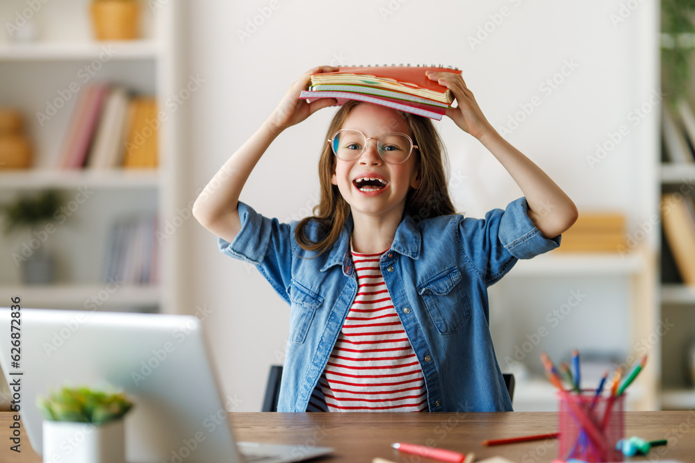 Girl doing homework or online education.