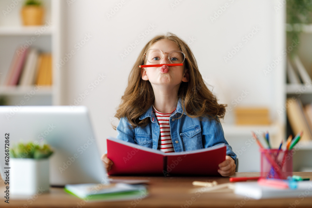 Girl doing homework or online education.