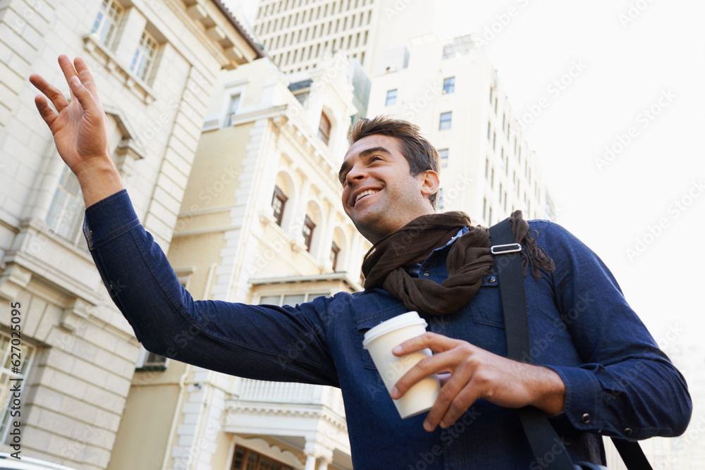 I havent seen you in years. Low angle shot of a man drinking a coffee and greeting someone in the ci