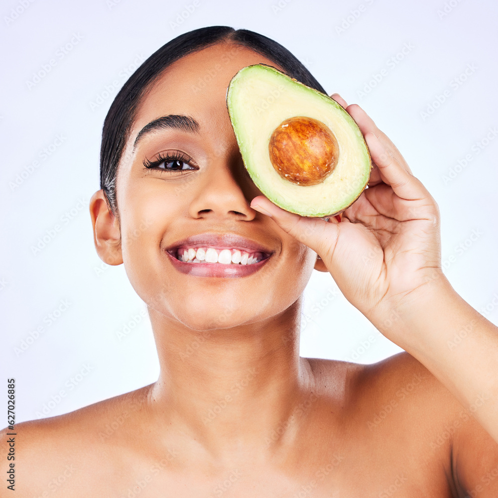 Skincare, avocado and portrait of Indian woman in studio happy with detox, wellness or omega 3 treat