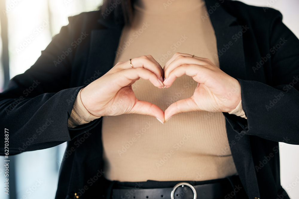 Closeup of a businesswoman with a heart shape in the office for care, support and valentines day. Zo