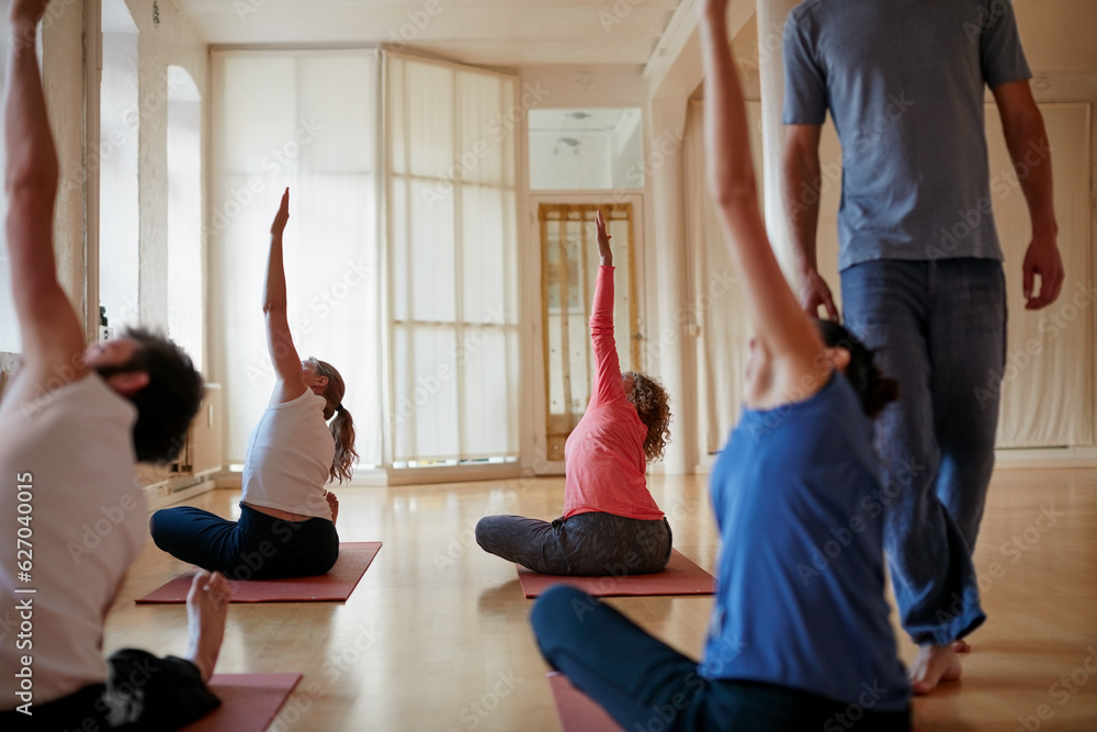 Are looking to take your practice in new directions. Shot of a group of people attending a yoga clas