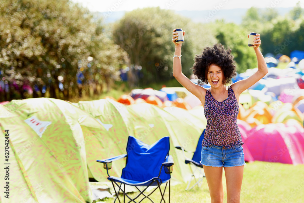 She loves the summer sun. An attractive young woman standing outside during a festival.