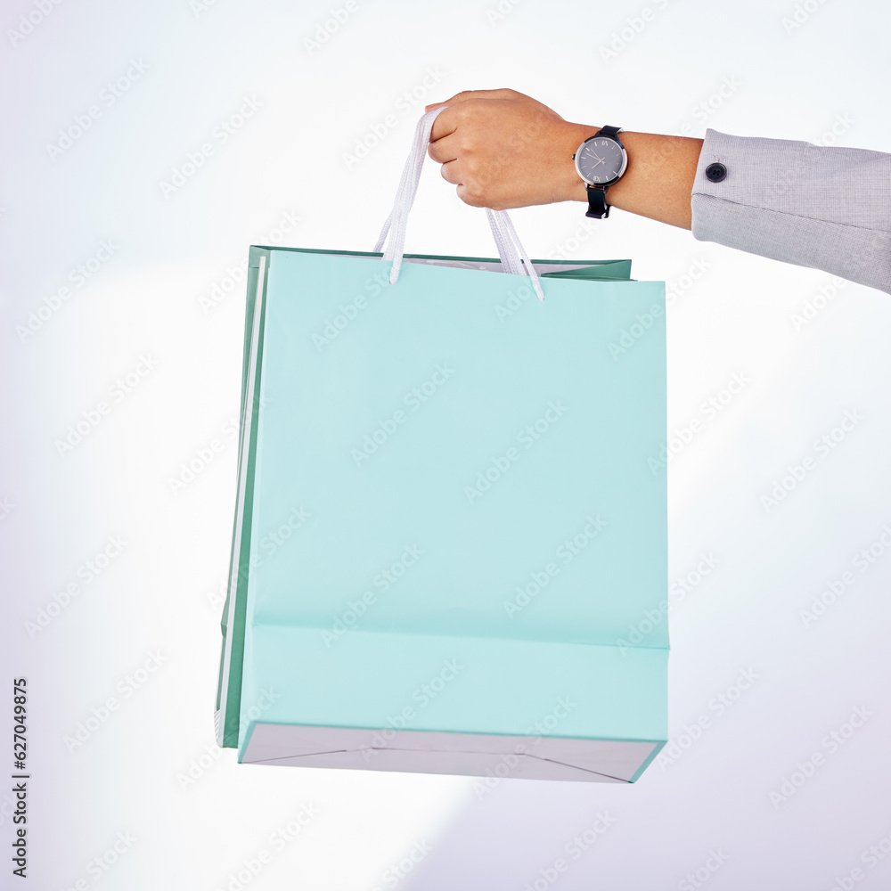 Hands, person and bag of shopping in studio, white background or fashion deal in retail product. Clo