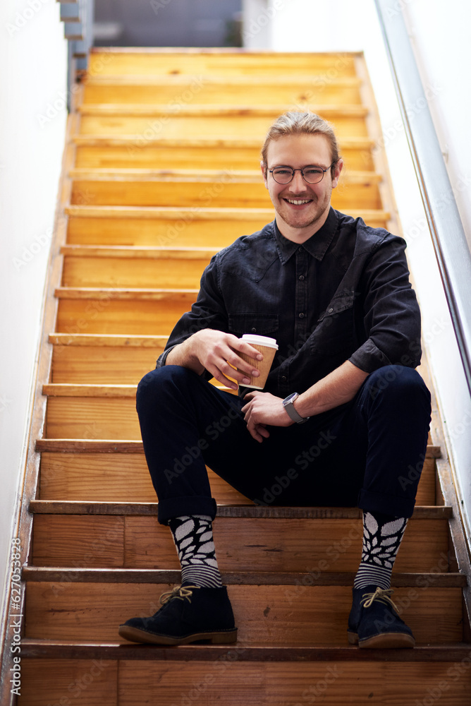 I need coffee to recharge. Full length portrait of a handsome young businessman sitting on the offic