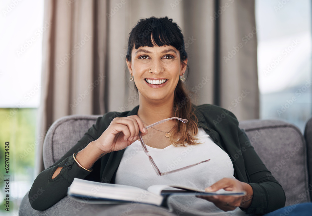 This is my happy place. Cropped portrait of an attractive young woman sitting alone in her living ro