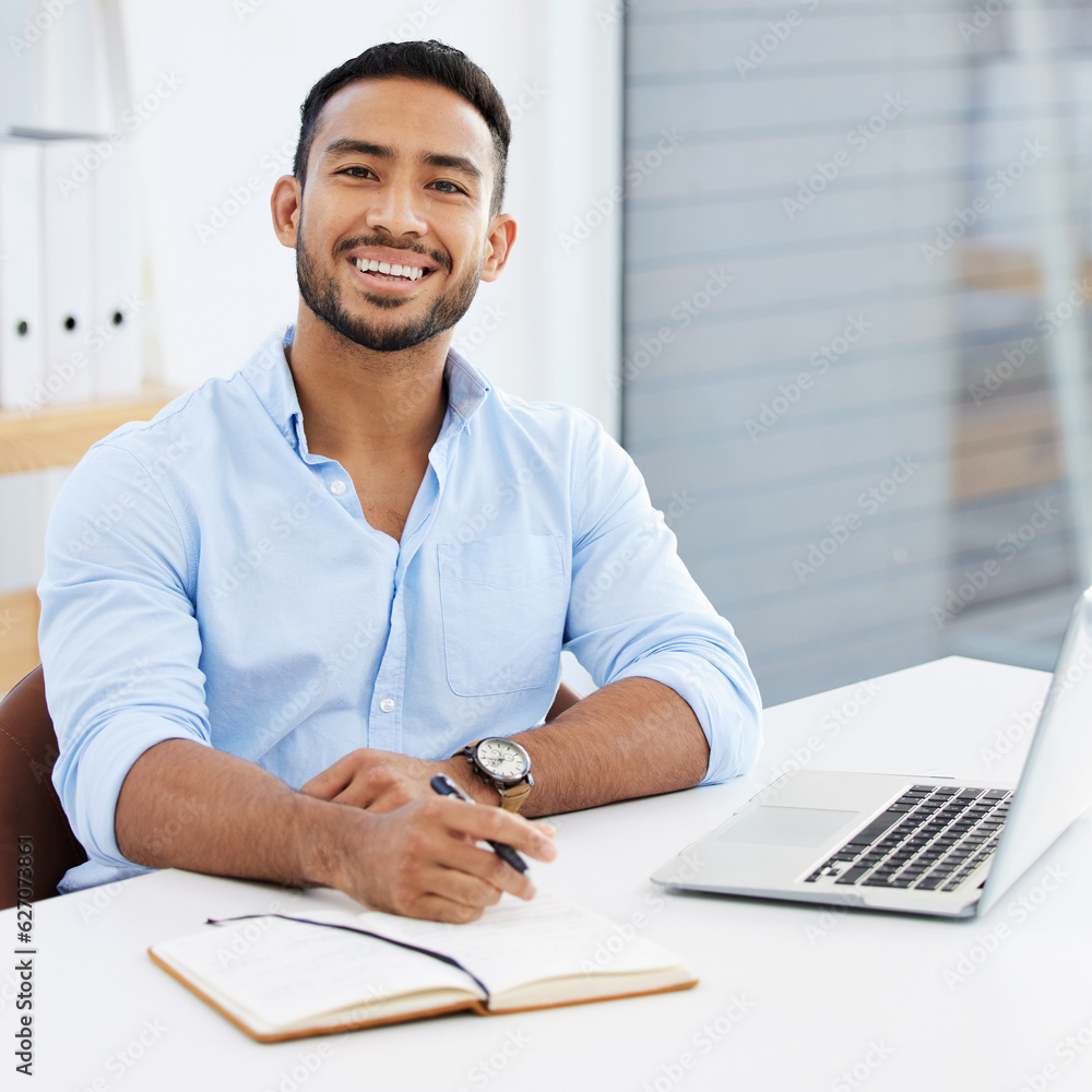 Portrait, businessman writing in a book and with laptop smile at desk of his modern work office. Suc