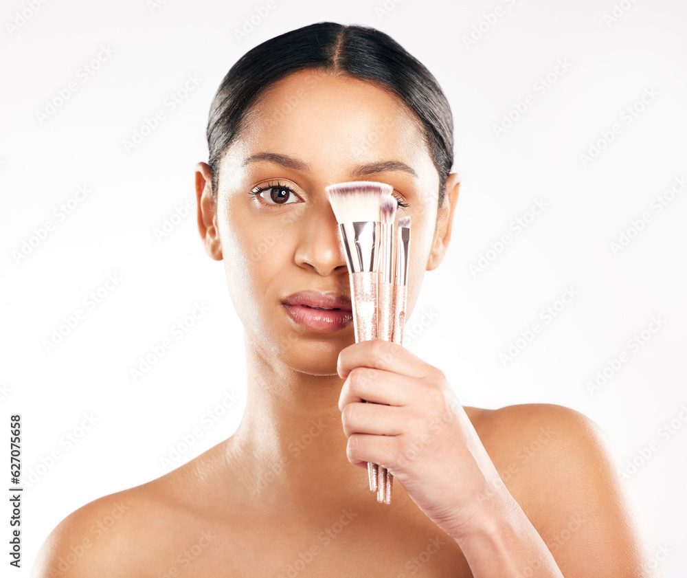 Woman, portrait and face with brushes for makeup, beauty cosmetics or skincare against a white studi