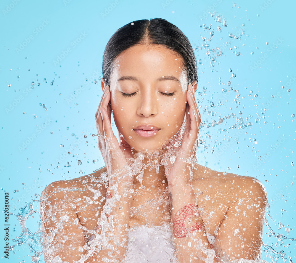 Skincare, water splash and face of woman in studio for wellness, healthy skin and cleaning. Bathroom