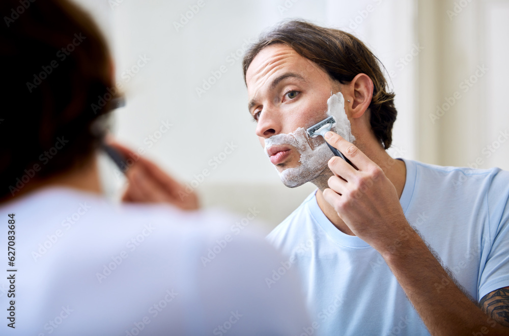 Man shave face in mirror, foam and beauty with morning routine, cosmetic care and grooming at home. 